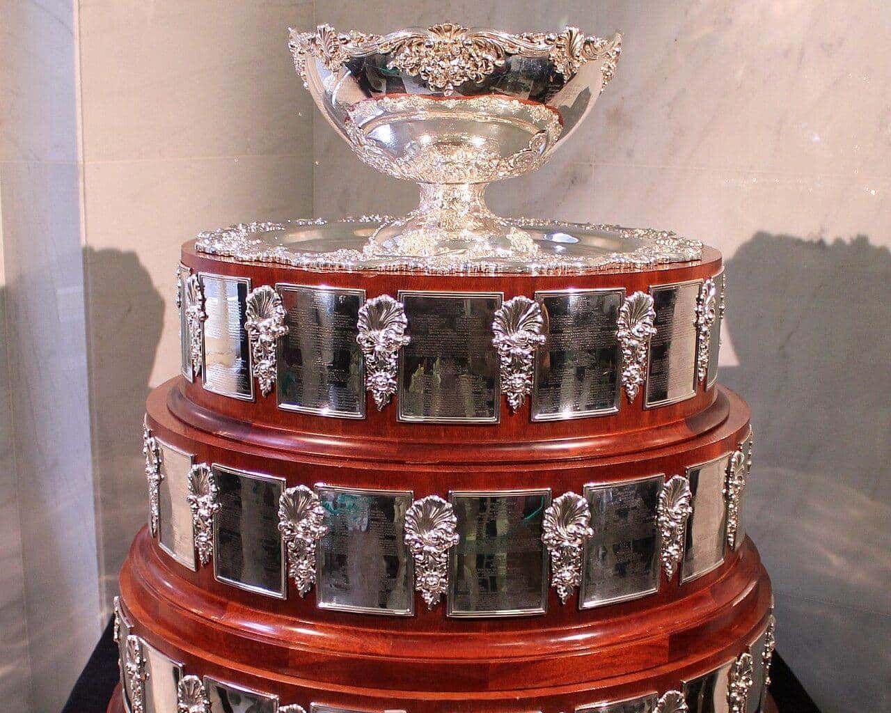 The silver Davis Cup trophy on a tiered wooden and silver base